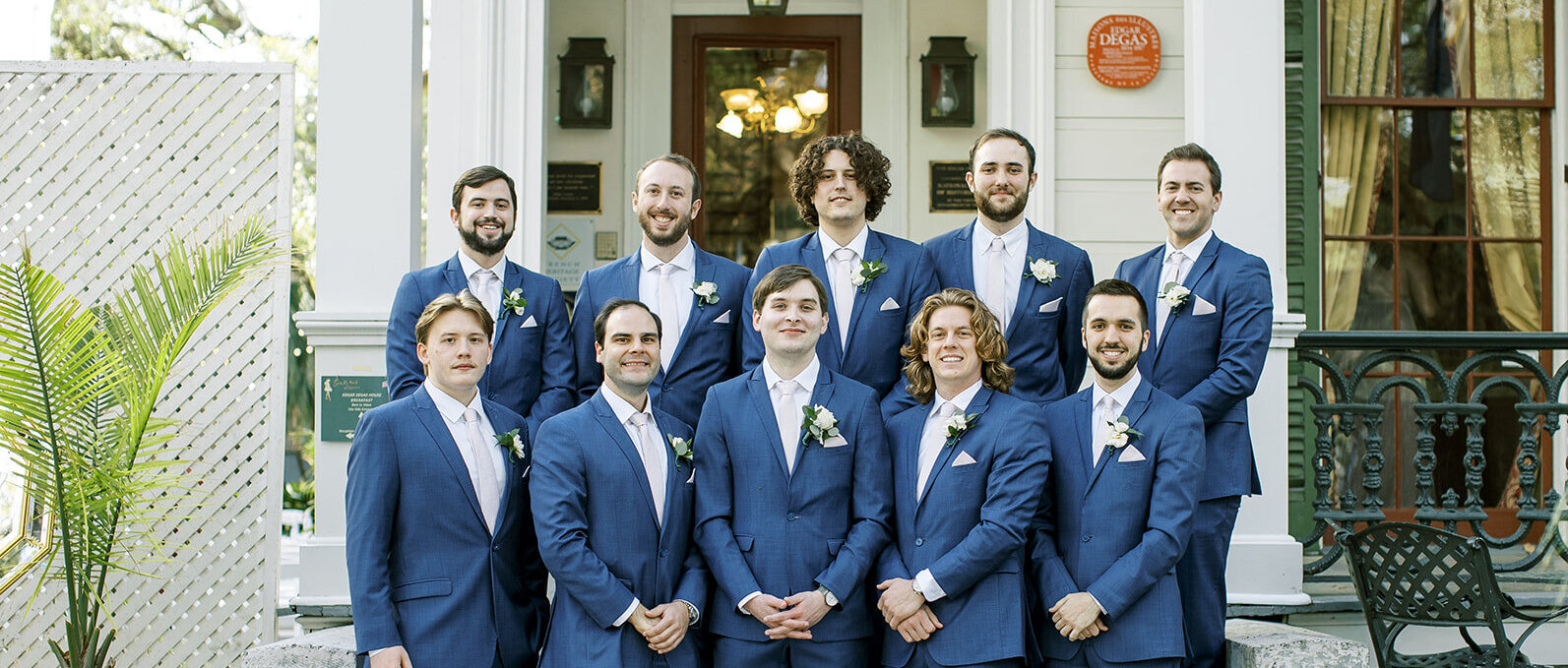 New Orleans groomsmen in blue suits posing for picture