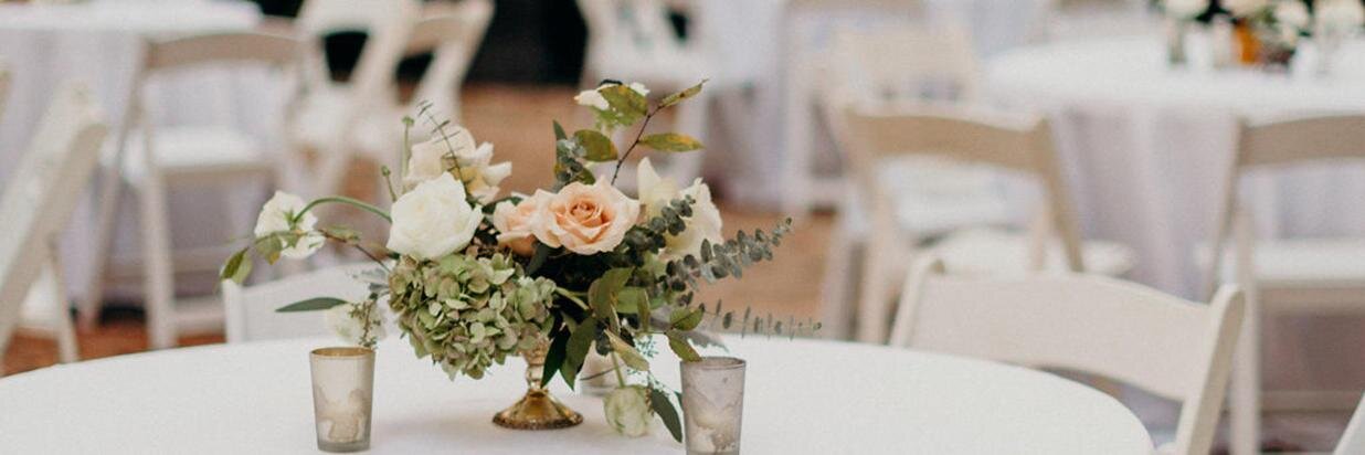 White table cloth with flowers at rehearsal dinner